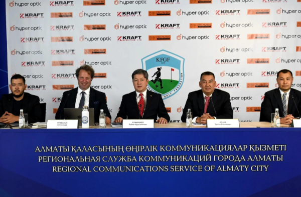 Five men in suits sit on a conference table in front of a banner with Hyper Optic, Kraft, and KFGF logos.
