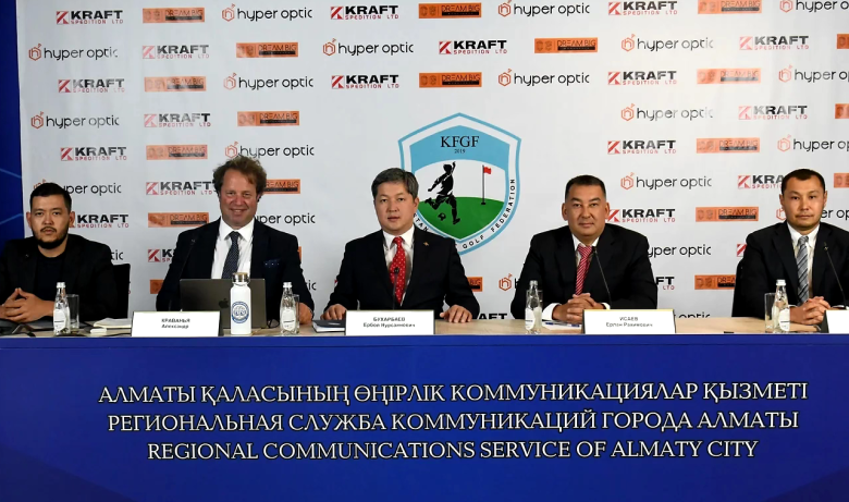 Five men in suits sit on a conference table in front of a banner with Hyper Optic, Kraft, and KFGF logos.