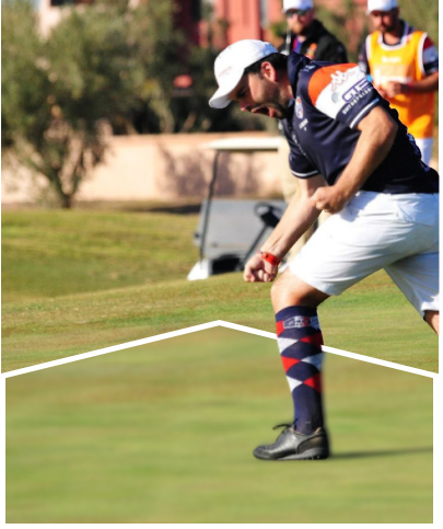 A player celebrating on the field as others watch in the background.