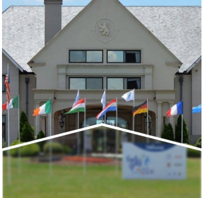A large building with international flags displayed in front.