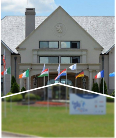 A large building with international flags displayed in front.